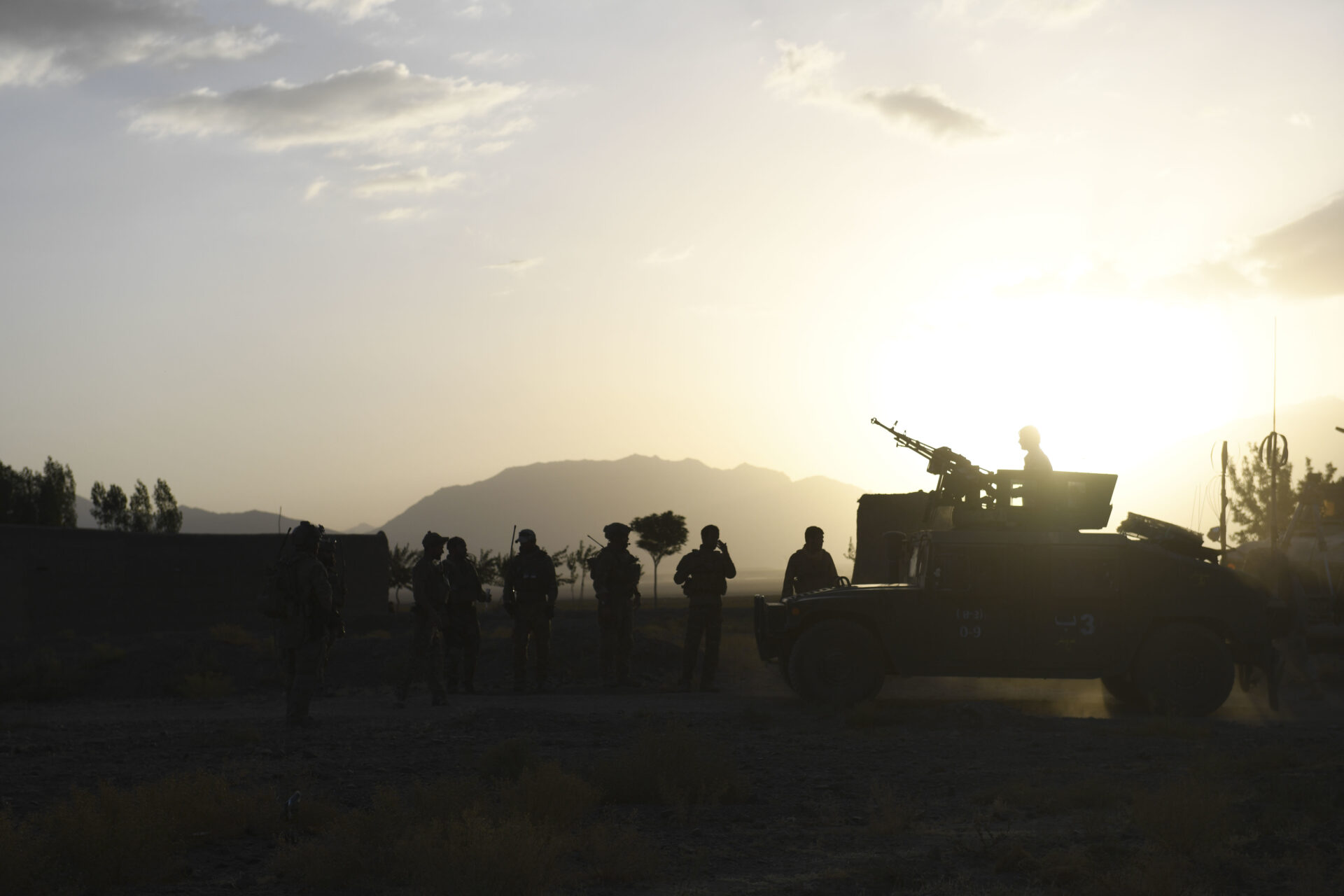 MOHAMMAD AGHA DISTRICT, Afghanistan (July 28, 2018) -- Afghan Special Security Forces and U.S. Special Operations soldiers enjoy a sunset in Mohammad Agha district, Logar province, Afghanistan, July 28, 2018. (U.S. Air Force photo by Staff Sgt. Nicholas Byers)