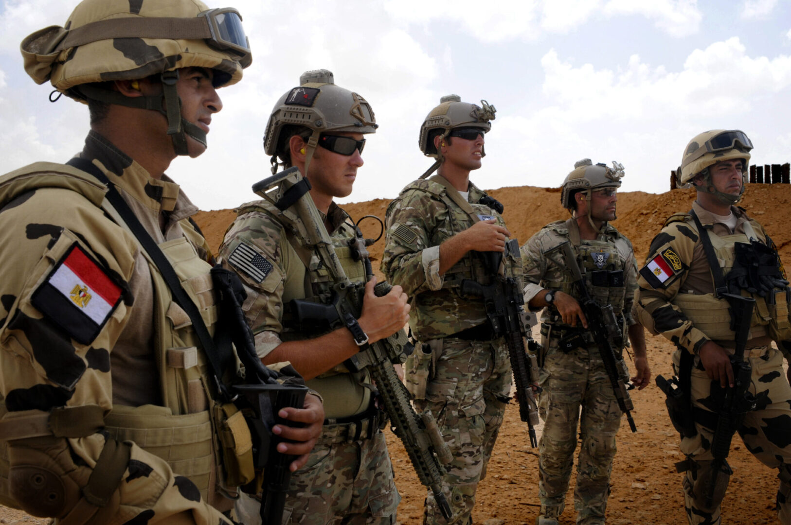 Egyptian and U.S. Special Operations Soldiers observe a small arms range, which was part of Exercise Bright Star. The exercise is held to promote and enhance regional security and cooperation between the seven participating nations, which include the Arab Republic of Egypt, the United States, Jordan, the Kingdom of Saudi Arabia, Greece, the United Kingdom, and France.